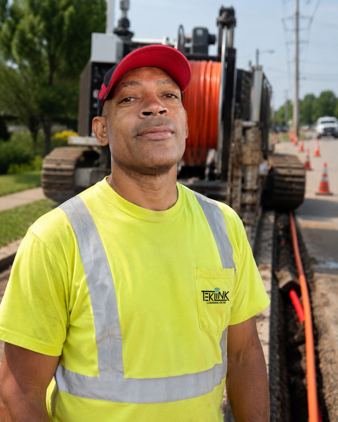 Environmental portrait of Richard McElroy on a jobsite, matching the Robert Rose shot for lighting, framing and background so the two sit together on the page.